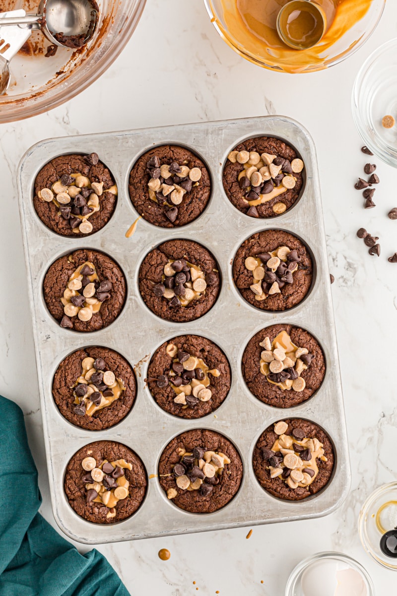 Overhead view of brownie peanut butter cups in pan