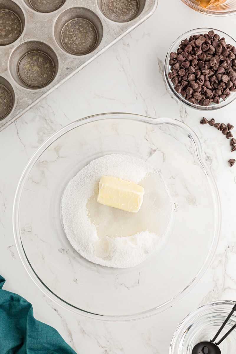 Overhead view of sugar, water, and butter in mixing bowl