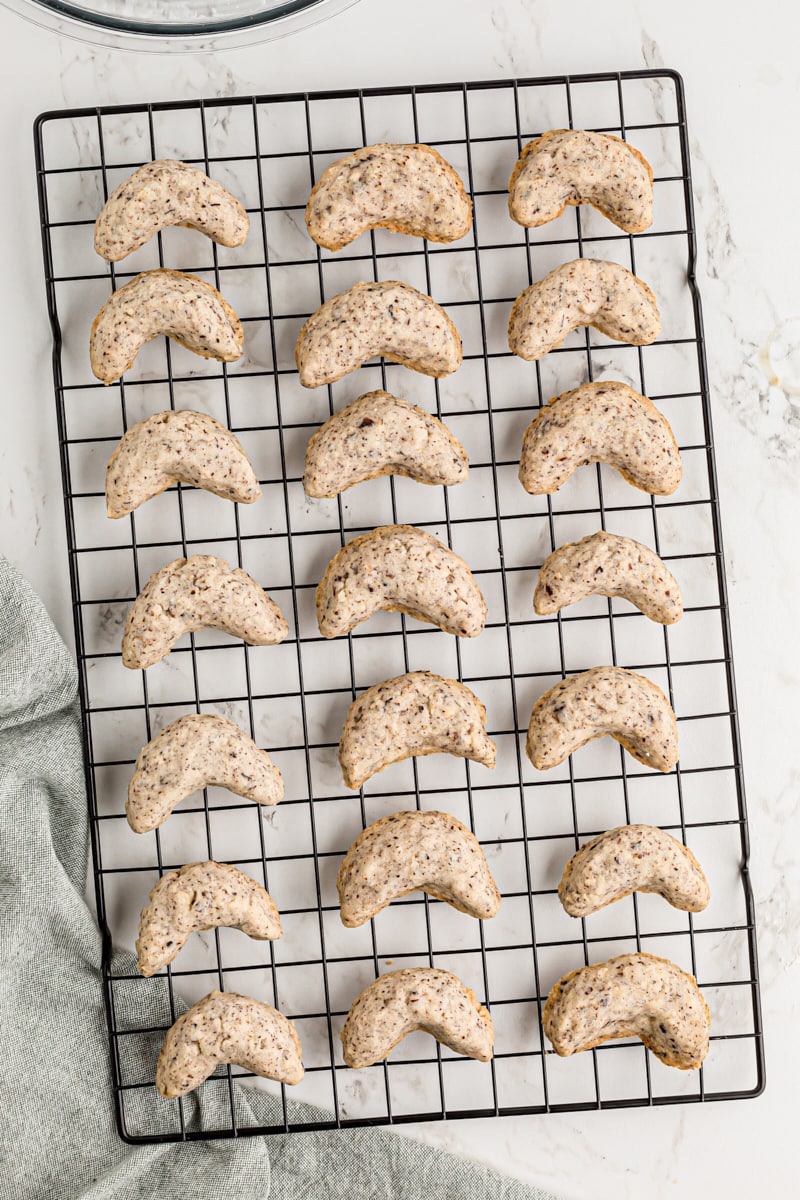 Overhead view of cooling hazelnut crescents on rack