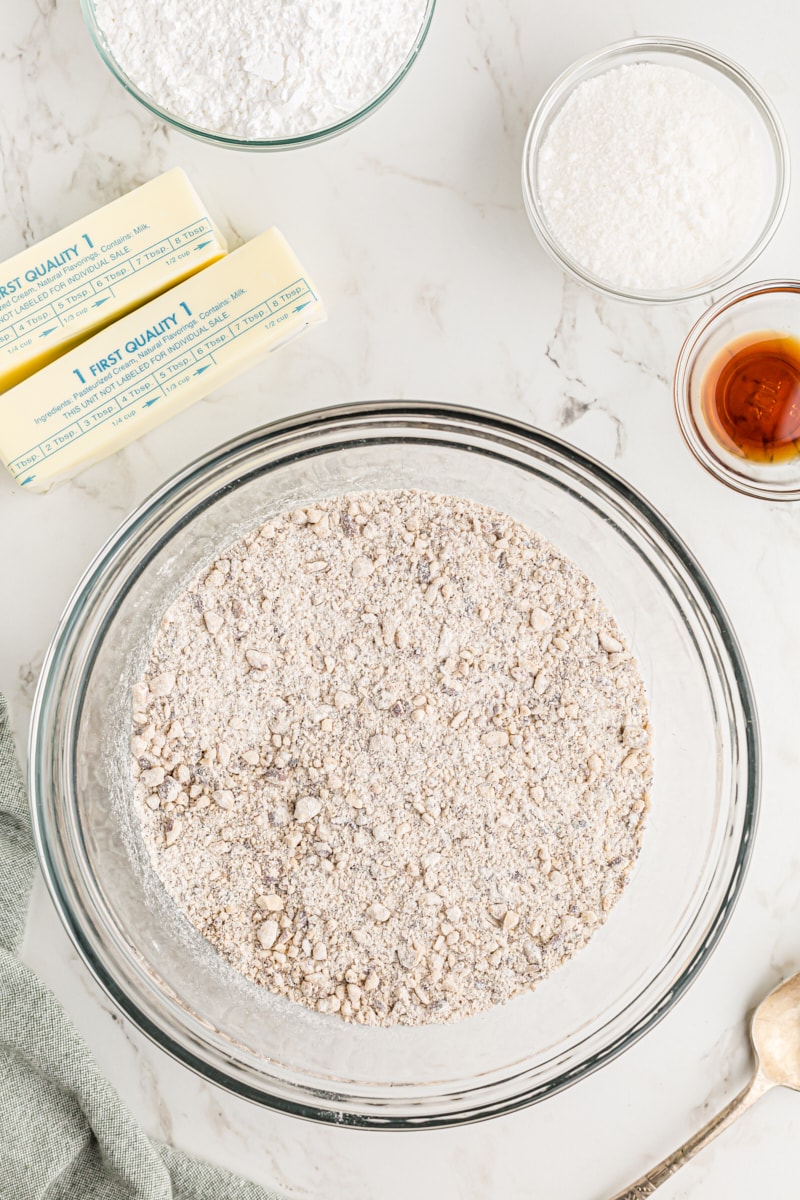 Overhead view of dry nut crescent ingredients in mixing bowl