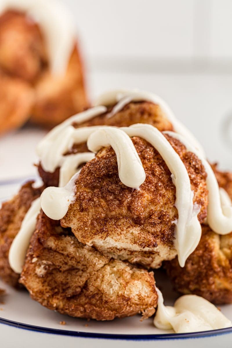 pieces of Monkey Bread topped with cream cheese icing
