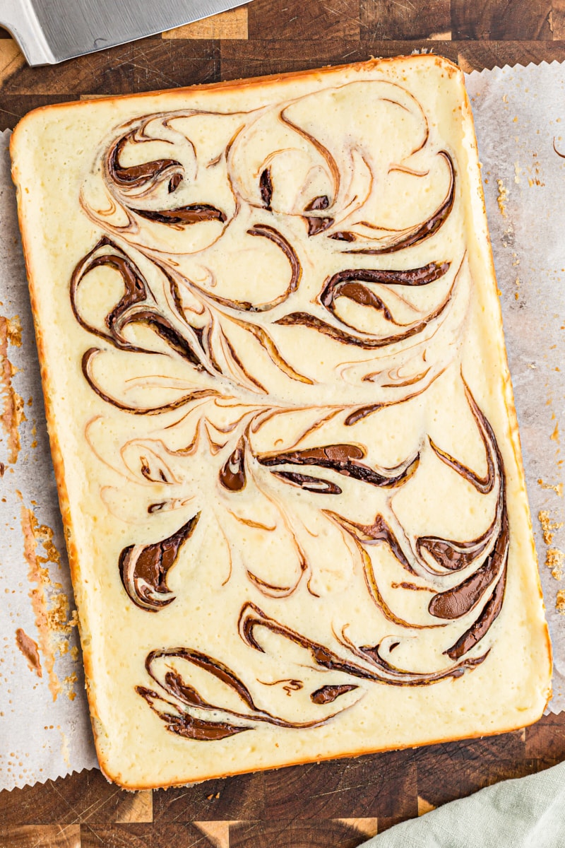 Overhead view of uncut Nutella swirl cheesecake bars