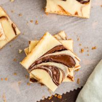 Overhead view of stacked Nutella swirl cheesecake bars