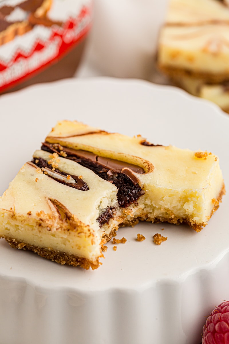Nutella swirl cheesecake bar with bite taken out of corner