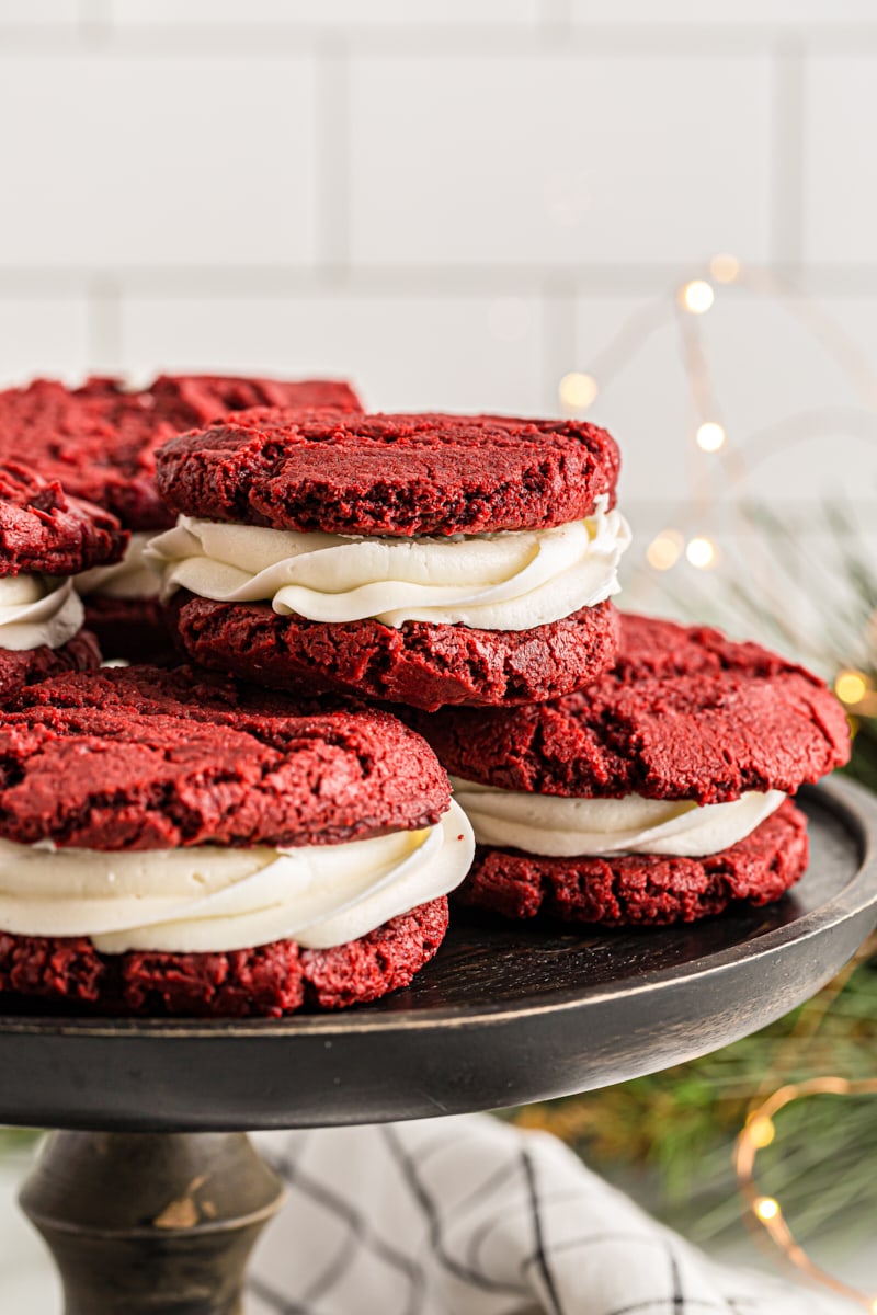 Red Velvet Cookies served on a black wooden cake stand