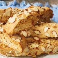 a pile of Almond Biscotti on a white plate
