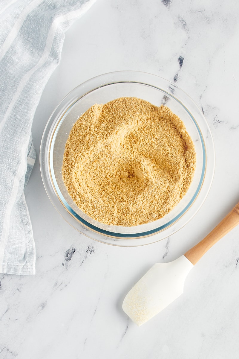 Graham cracker crumbs in a mixing bowl.