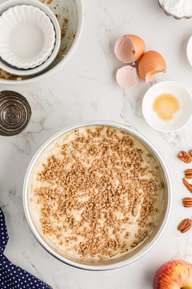 Overhead view of unbaked apple streusel coffee cake in pan