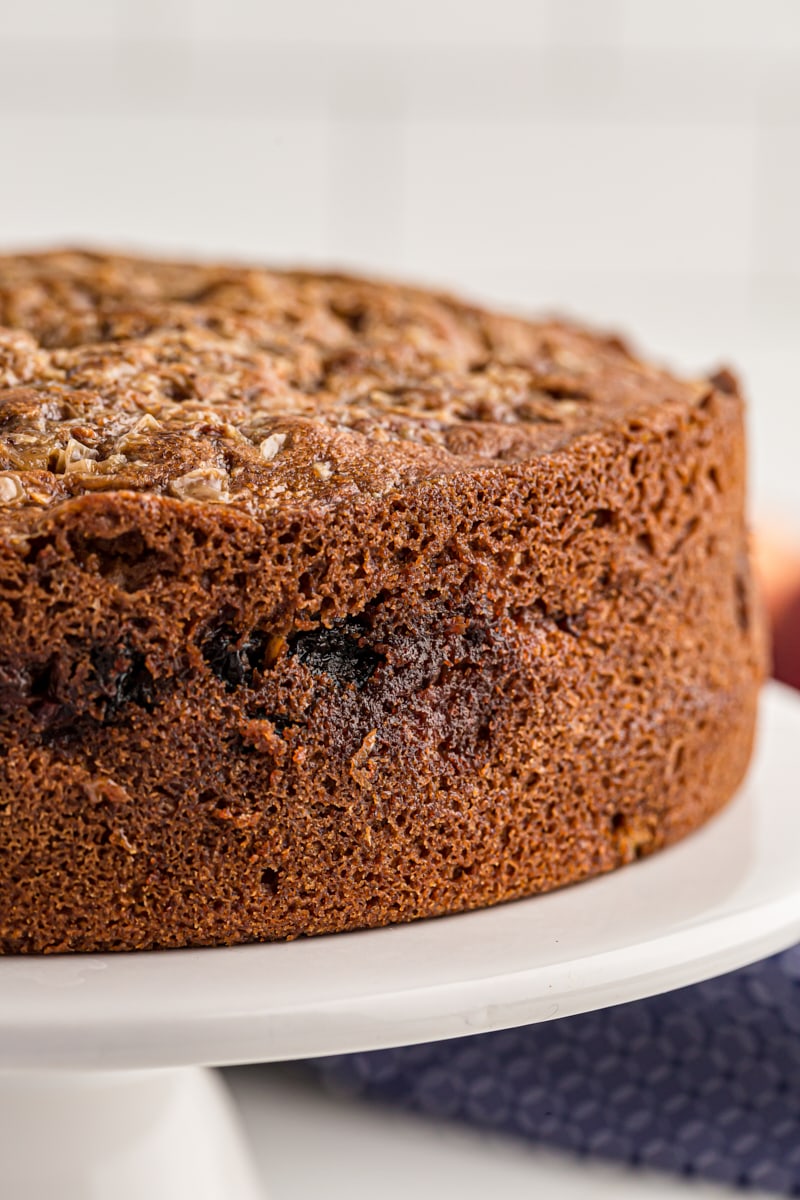 Closeup of apple streusel coffee cake on cake stand