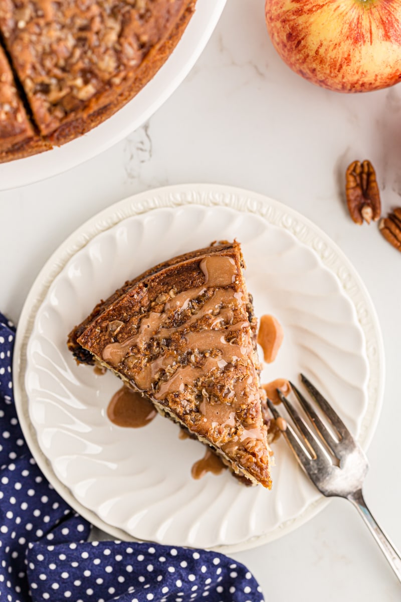 Overhead view of apple streusel coffee cake slice on plate with fork