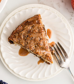 Overhead view of apple streusel coffee cake on plate with fork