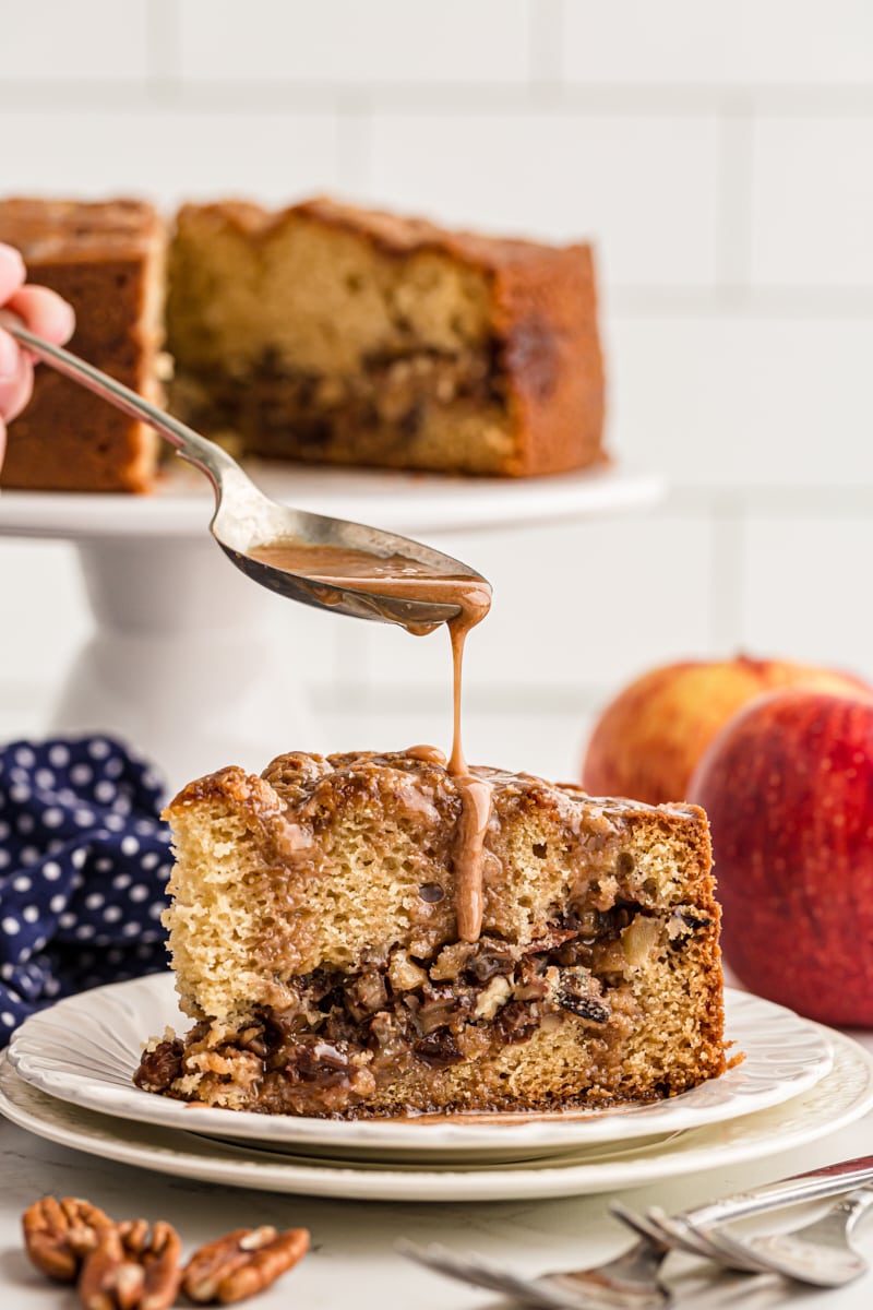 Drizzling glaze over apple streusel coffee cake