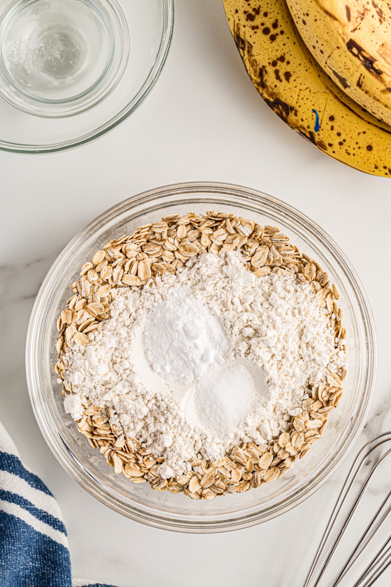 Overhead view of oats and dry ingredients in mixing bowl