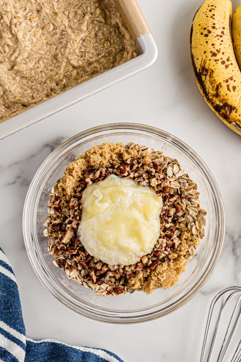 Overhead view of streusel topping in mixing bowl