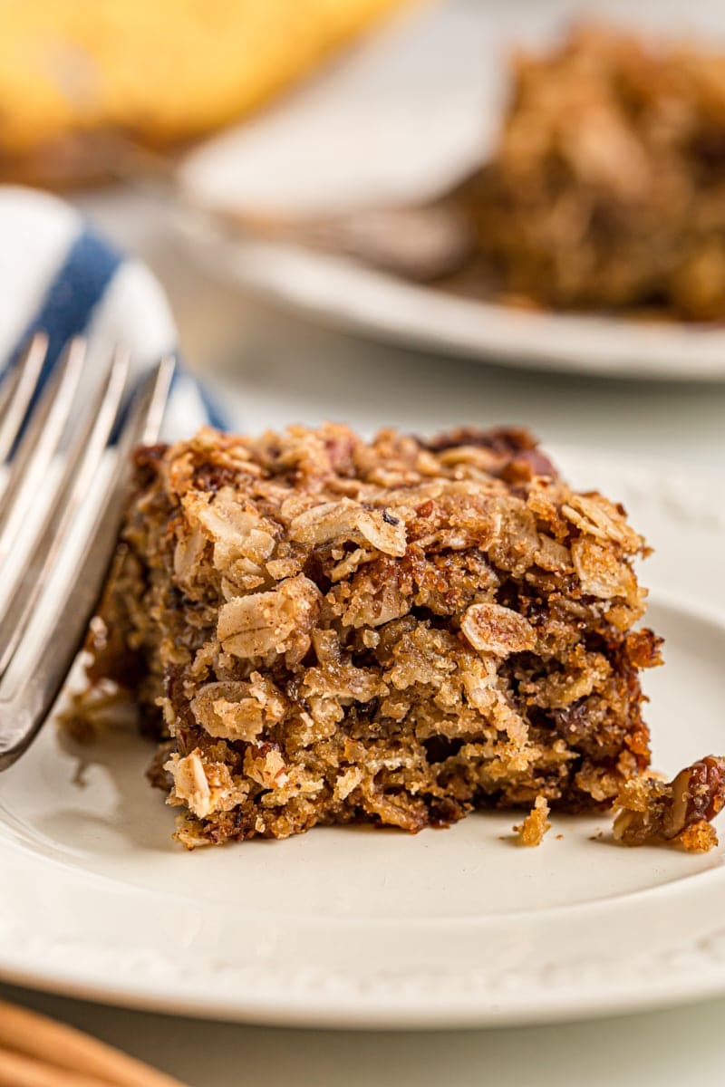 Square of banana oatmeal crumb cake on plate