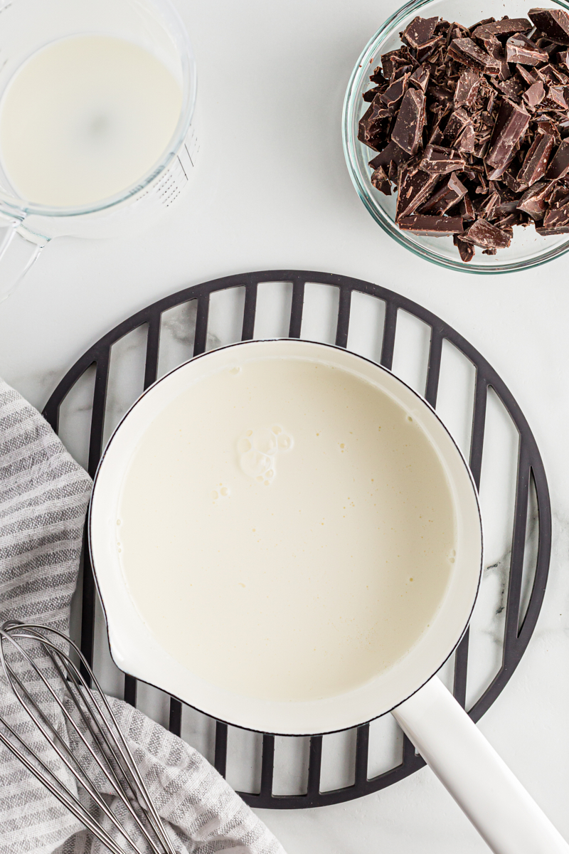 Overhead view of heavy cream in saucepan