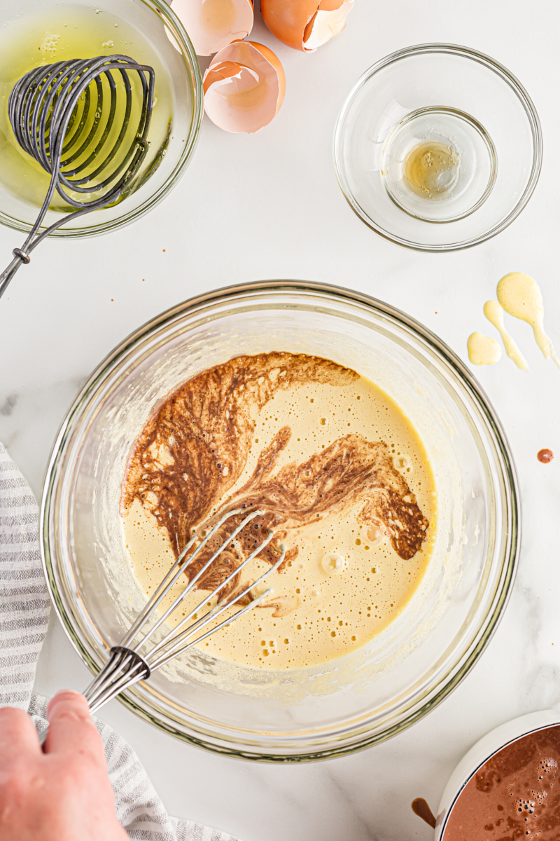 Overhead view of whisking chocolate into egg mixture