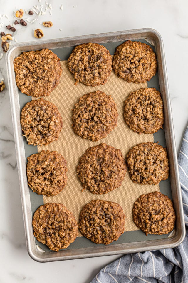 Cowboy cookies on parchment-lined baking sheet