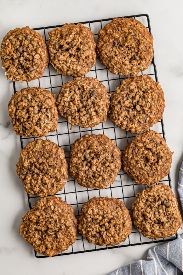 Overhead view of cowboy cookies cooling on wire rack