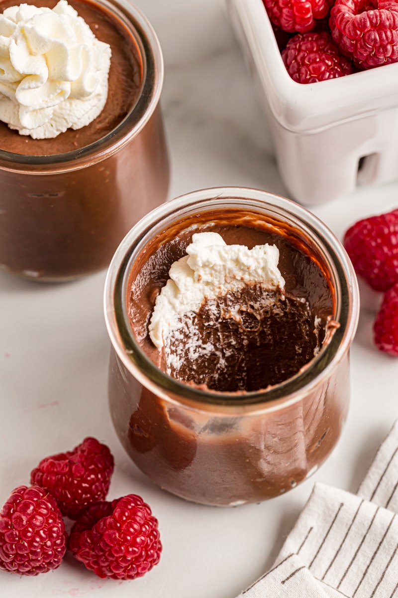 Two jars of double chocolate pudding, one with portion eaten
