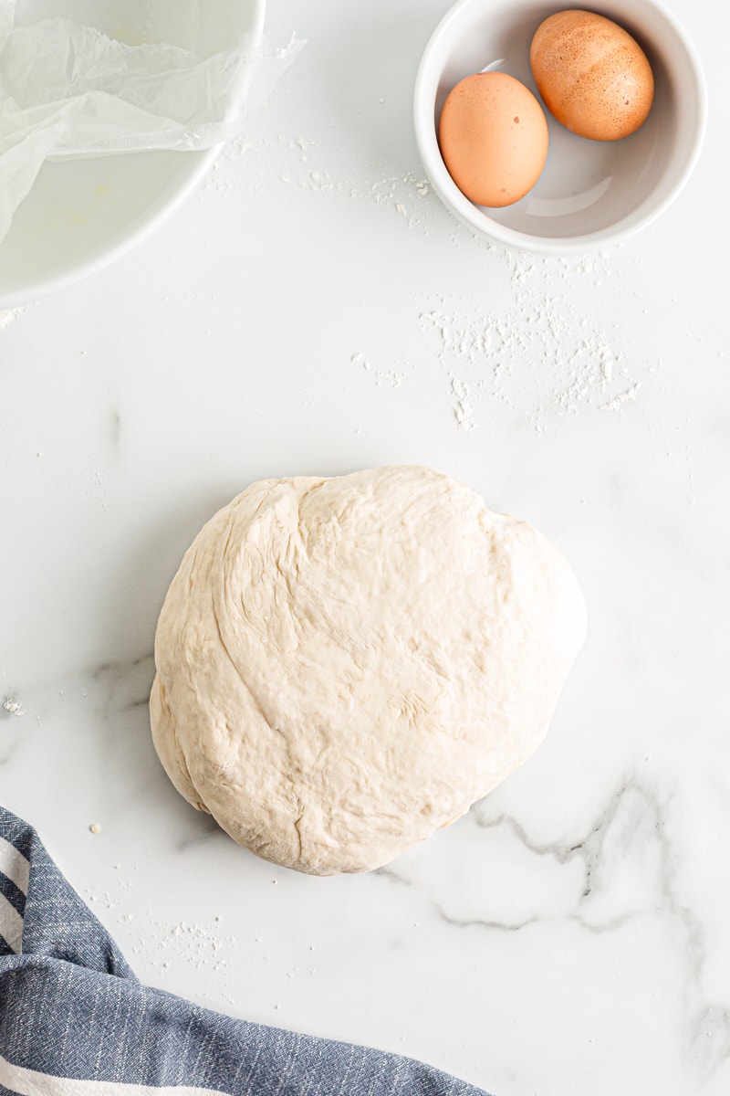 overhead view of pretzel dough on a lightly floured surface