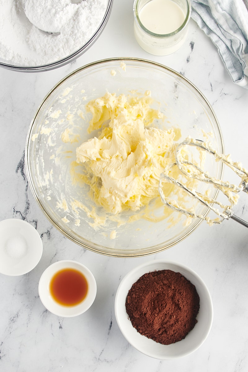 overhead view of creamed butter in a glass mixing bowl