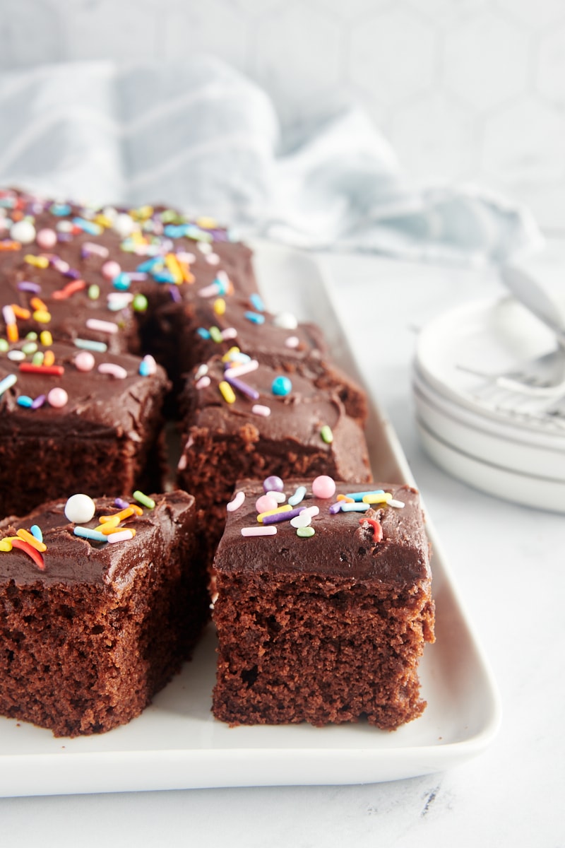 slices of Chocolate Sheet Cake on a large white tray