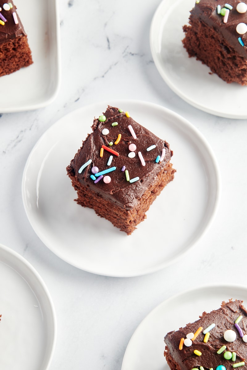 slices of Chocolate Sheet Cake on white plates