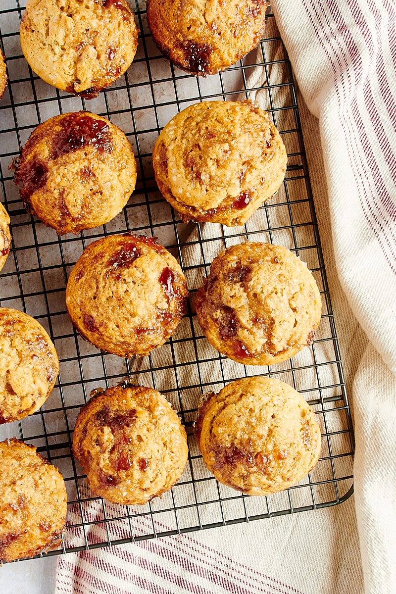 overhead view of Peanut Butter and Jelly Muffins on a wire cooling rack