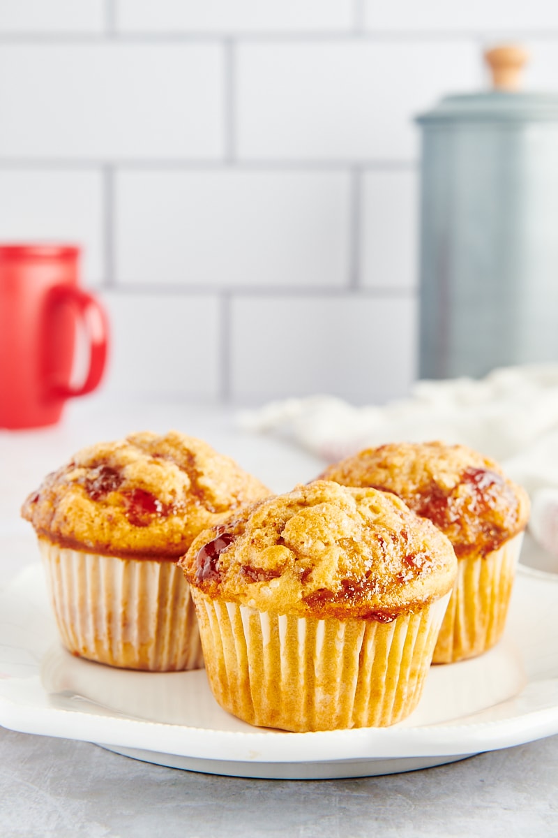 three Peanut Butter and Jelly Muffins on a white plate