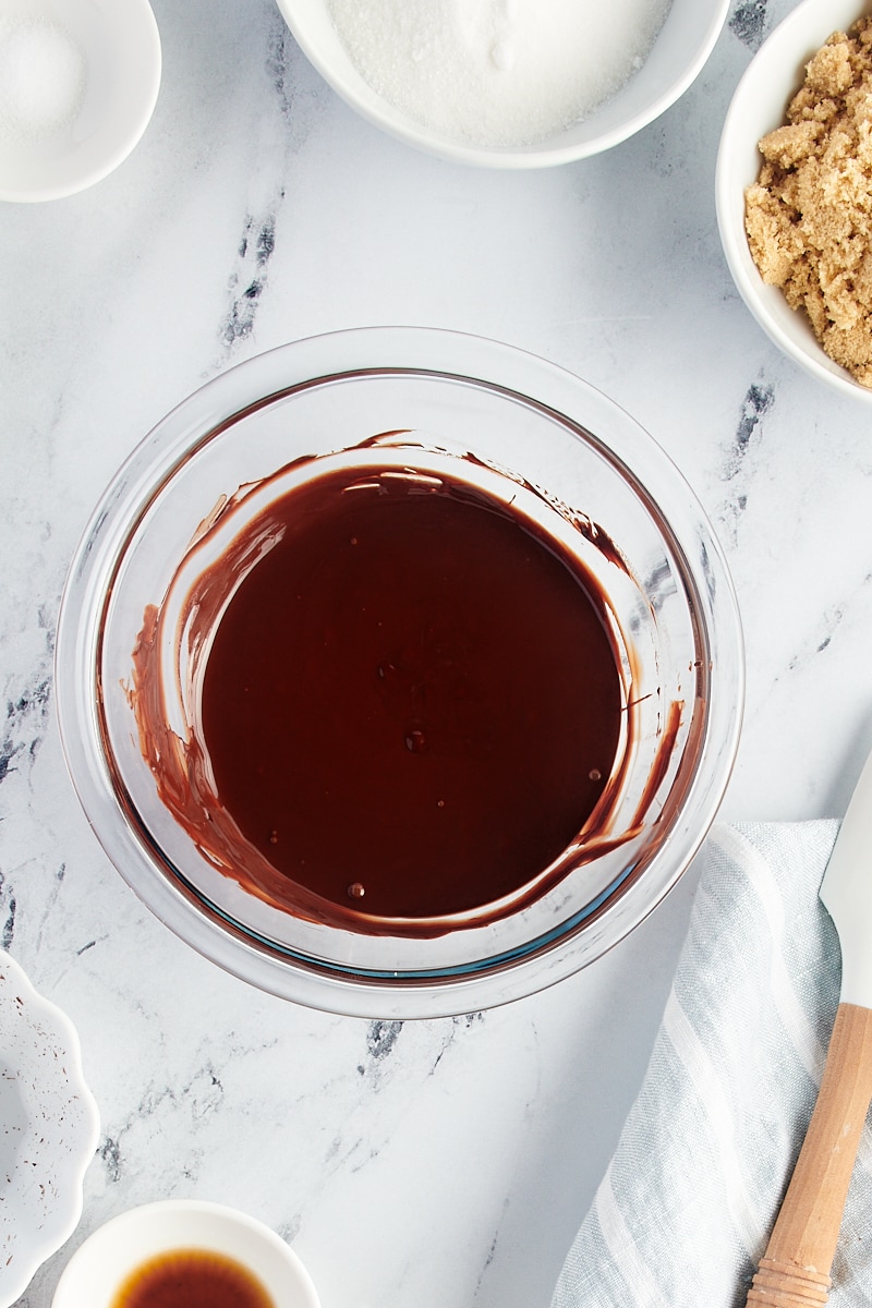 Overhead view of melted chocolate in glass bowl