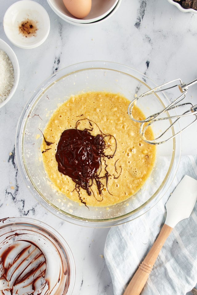 Overhead view of melted chocolate added to wet ingredients