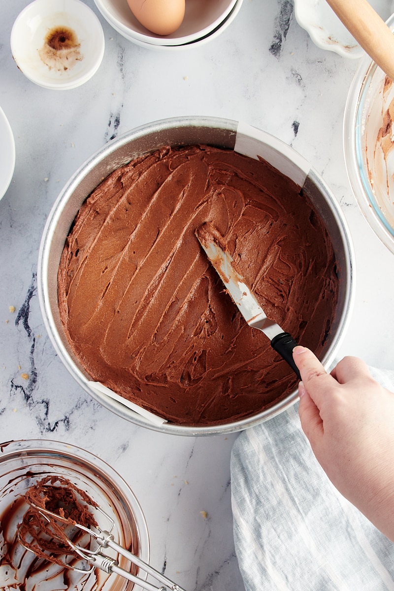 Spreading brownie batter into round pan