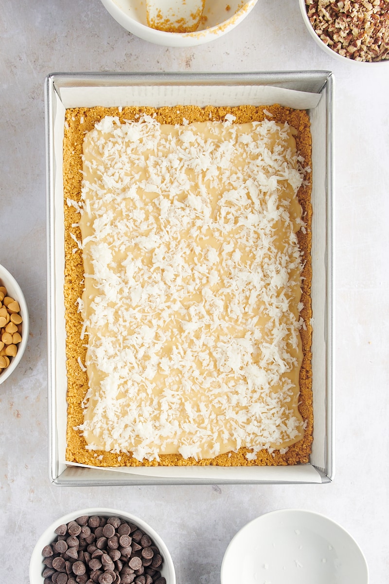 Overhead view of seven layer bars after adding coconut