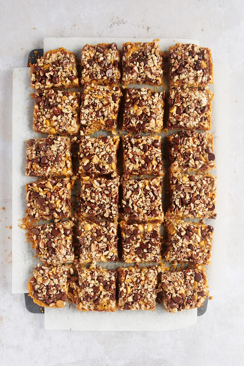 Cut seven layer bars on parchment paper