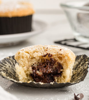 Chocolate-filled cupcake with bite taken out to show filling