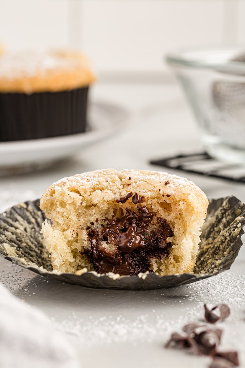 Chocolate-filled cupcake with bite taken out to show filling