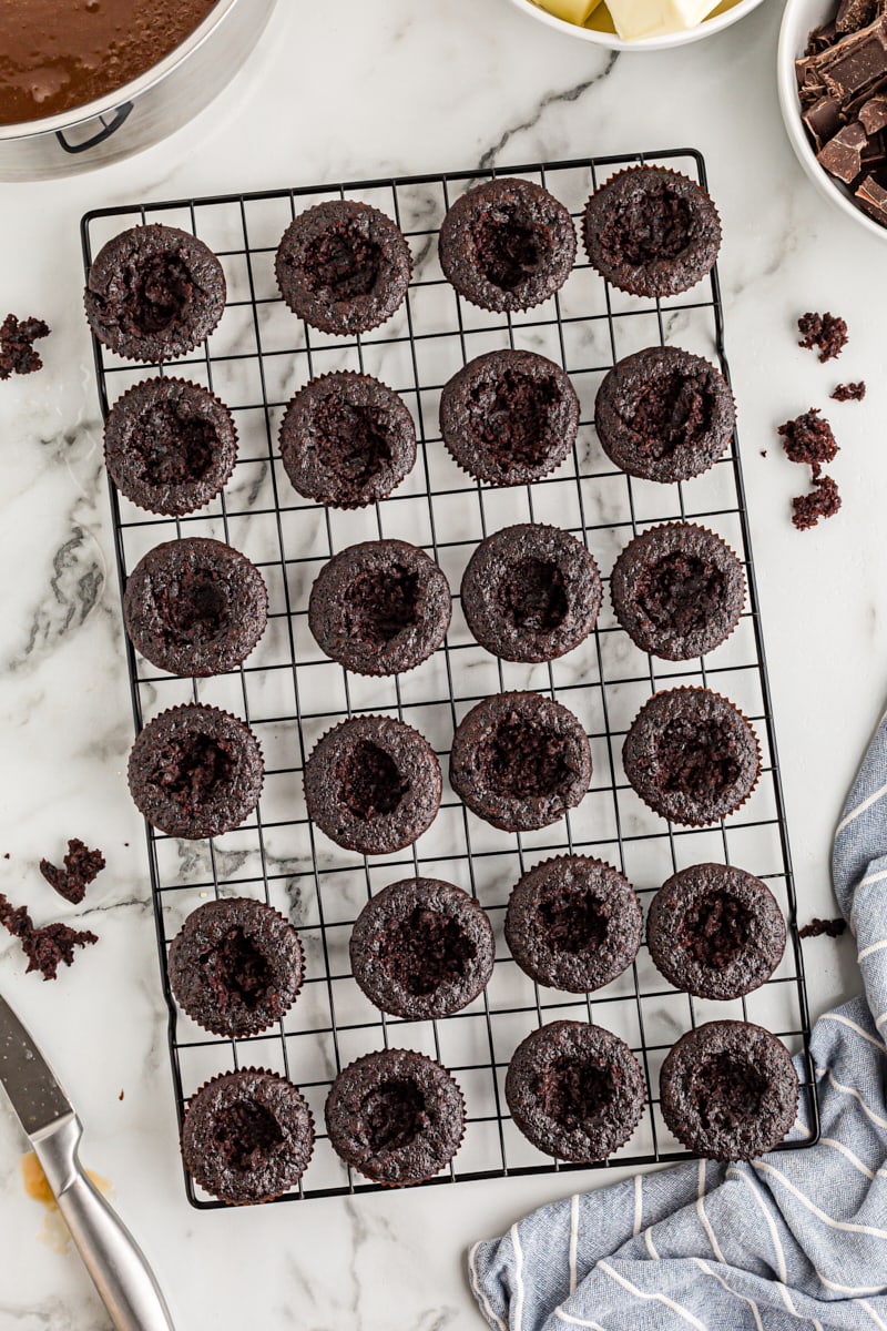 Overhead view of chocolate cupcakes with centers removed