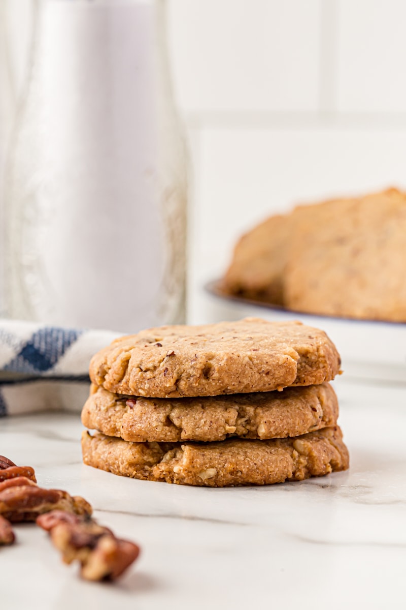 Stack of 3 pecan sandies cookies.