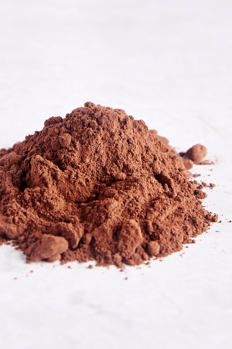 pile of cocoa powder on a white surface