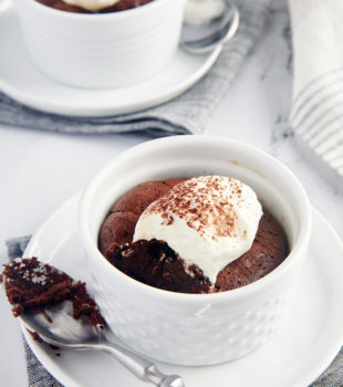 Flourless Chocolate Cakes for Two served in white ramekins set on white plates
