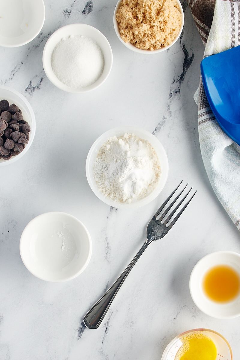 overhead view of flour, baking powder, baking soda, and salt in a small bowl