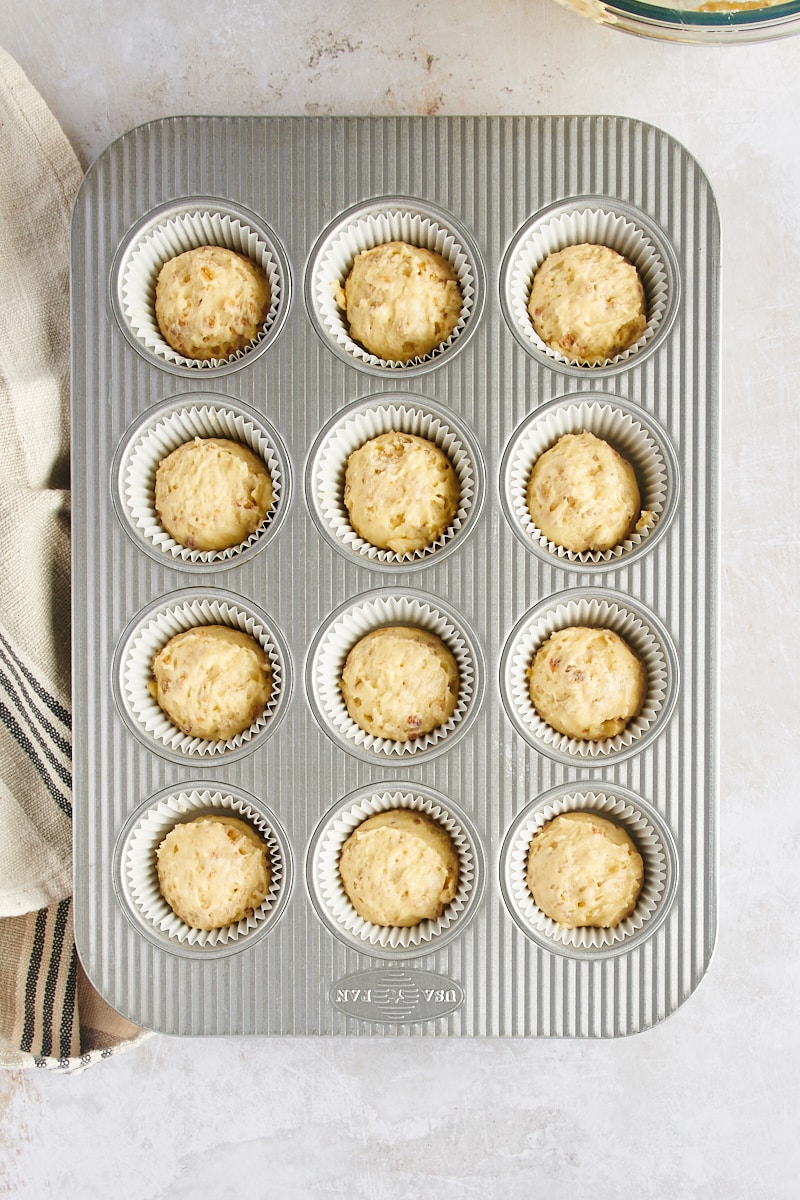 Overhead view of muffin batter in muffin cups