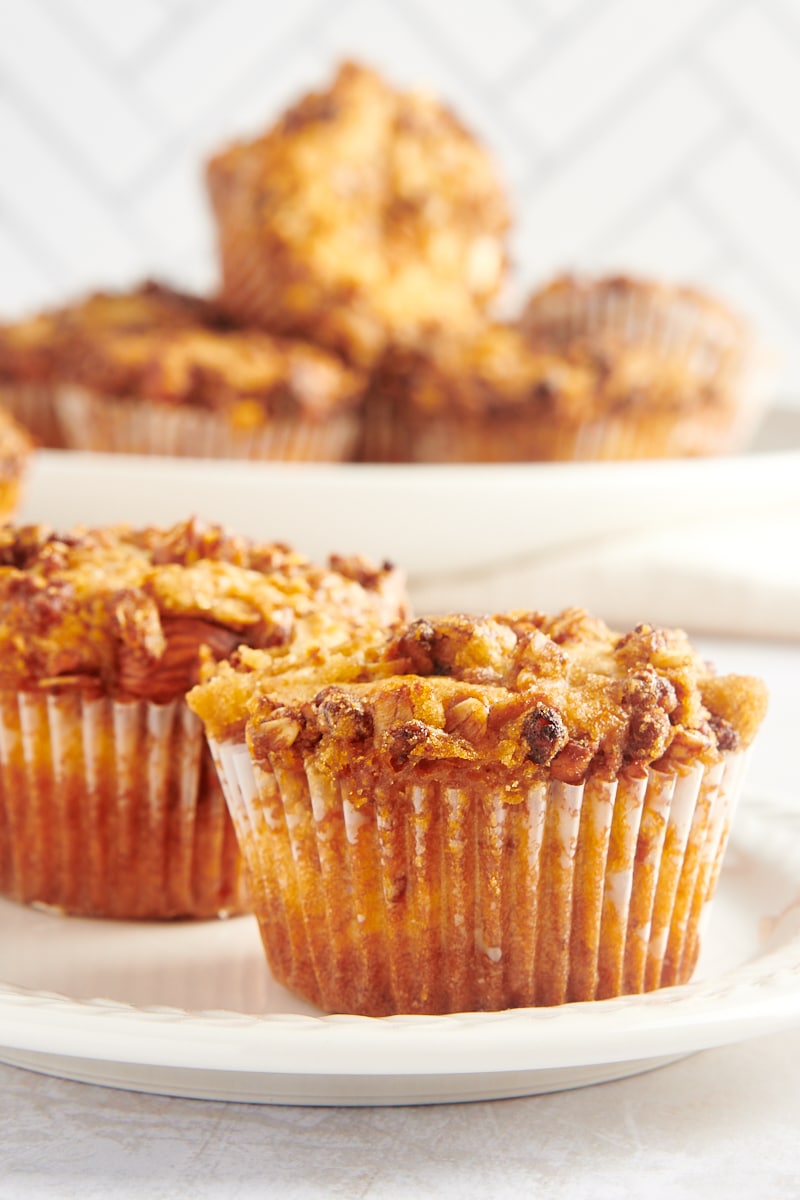 Two granola yogurt muffins on white plate