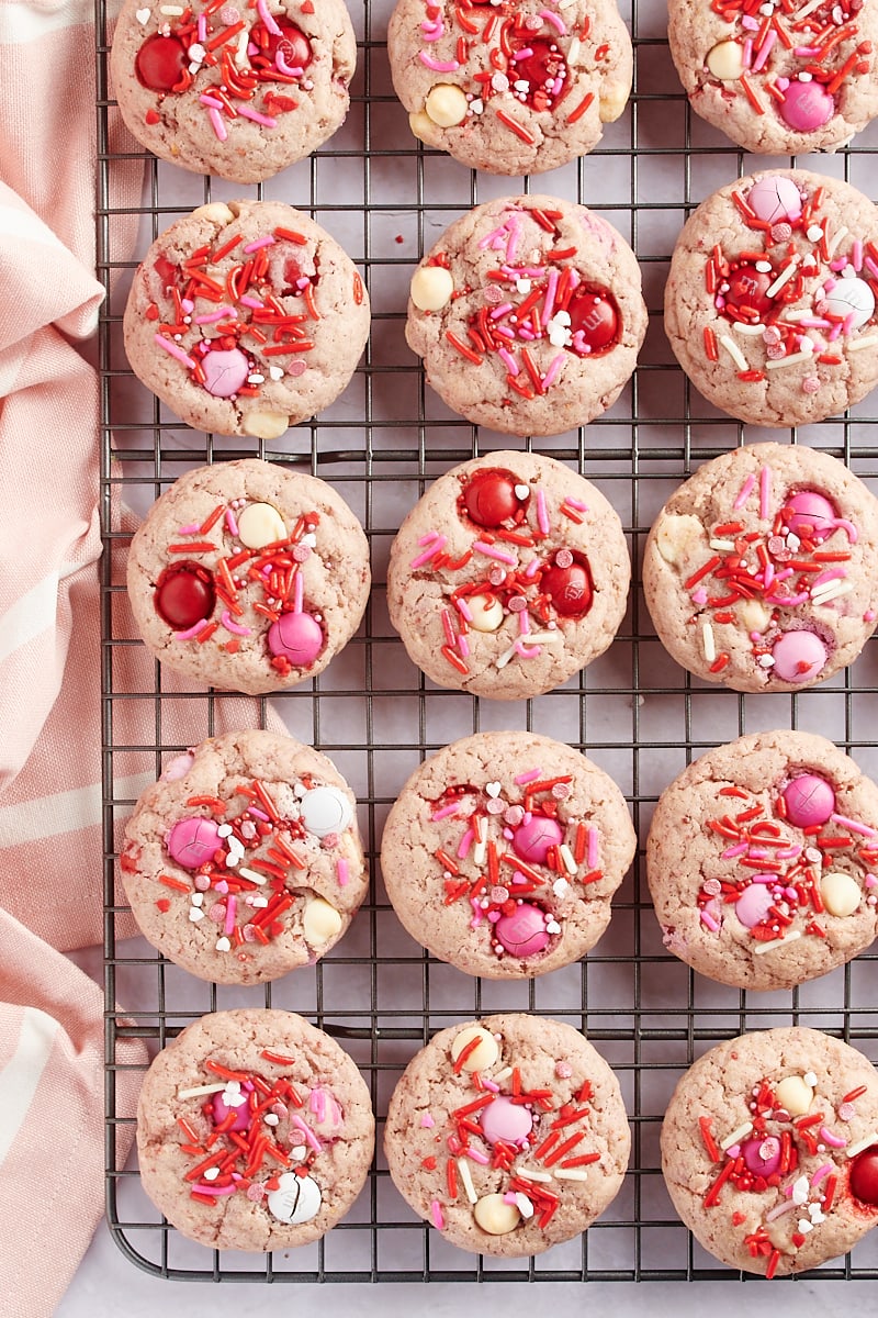 overhead view of Strawberry M&M Cookies on a wire cooling rack