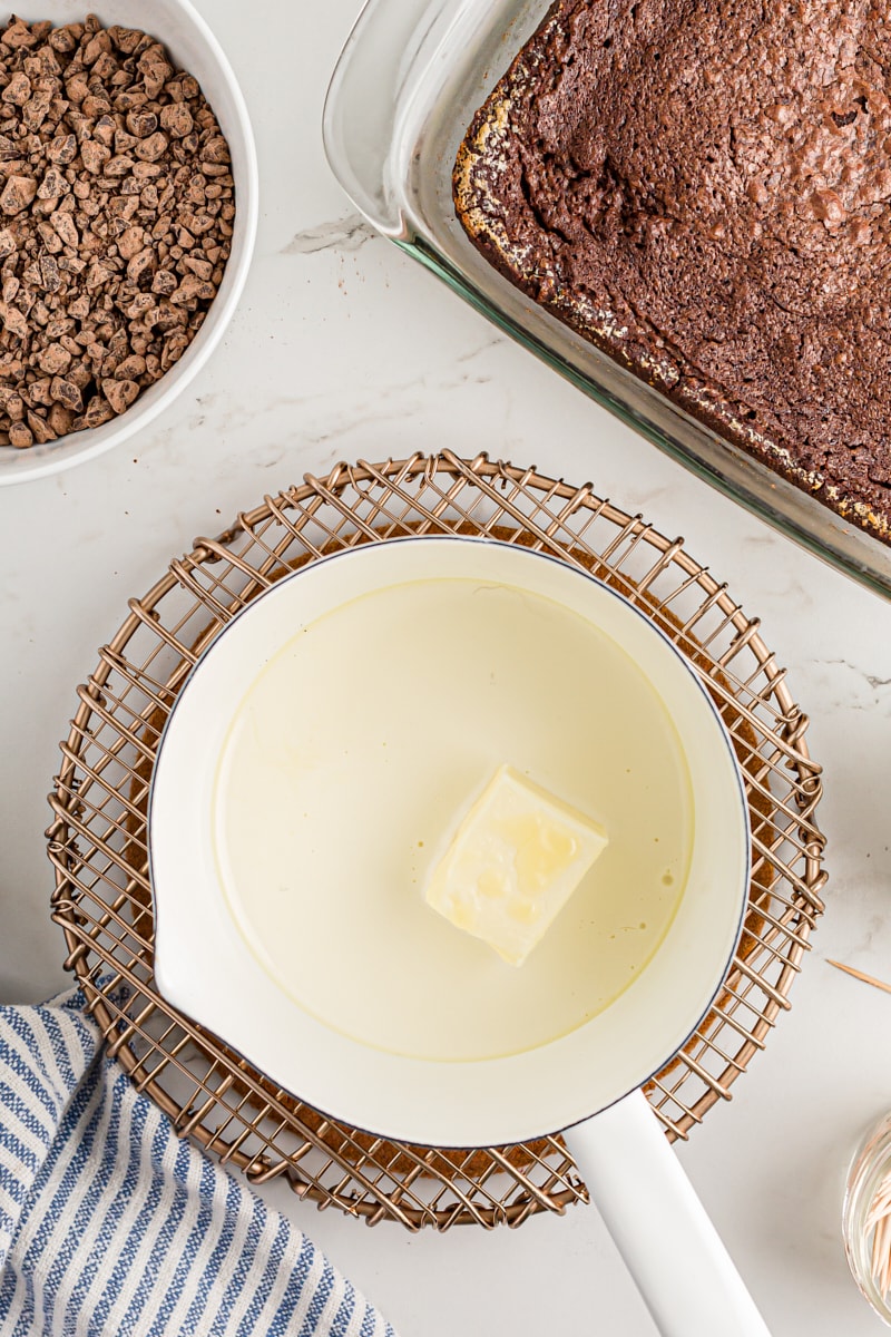 Overhead view of butter and cream in saucepan