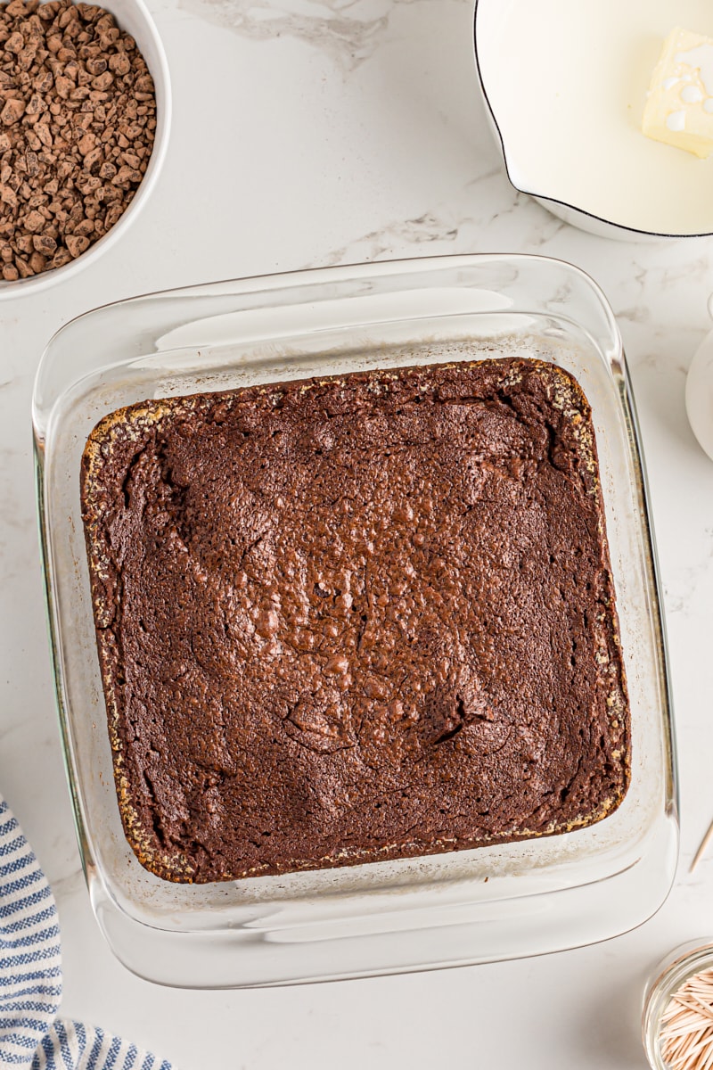 Overhead view of baked brownies in square glass baking pan
