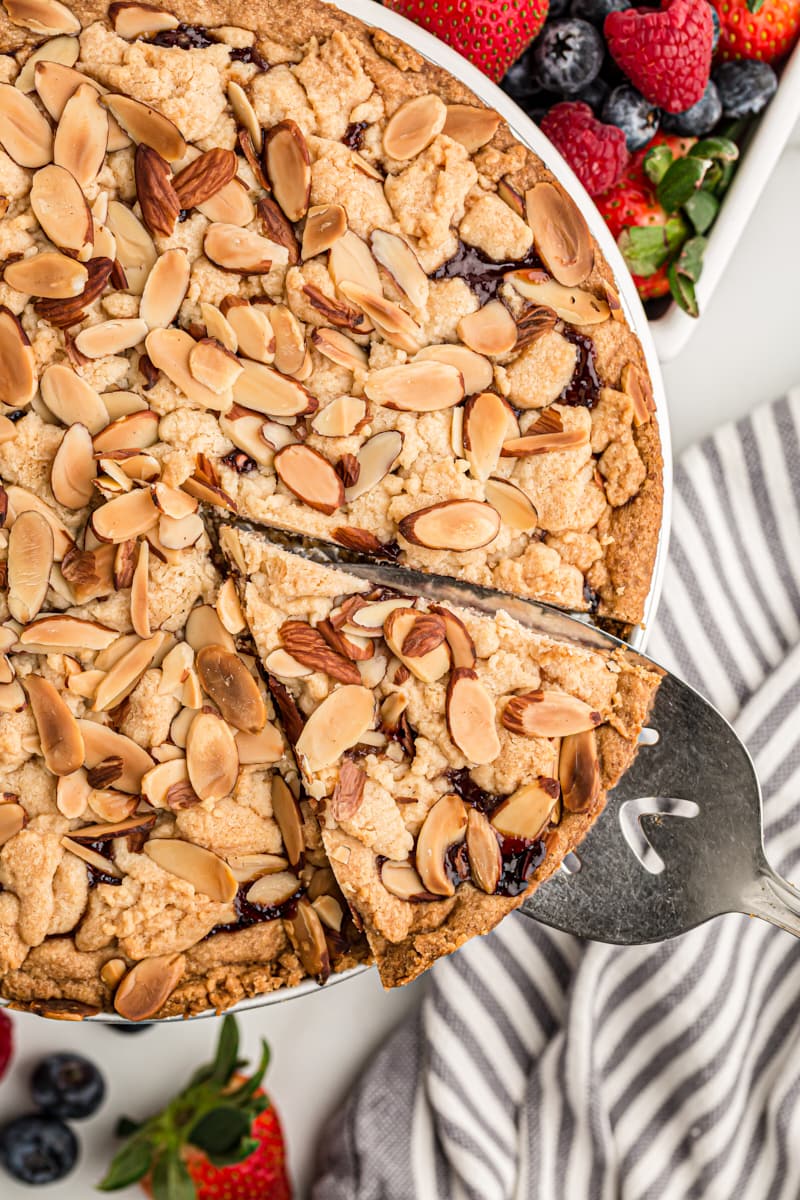 overhead view of Italian Jam Crostata with a slice on a pie server