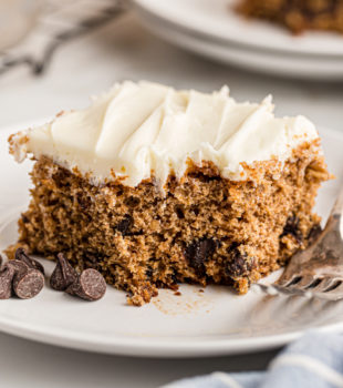 Oatmeal chocolate chip cake on plate with corner eaten
