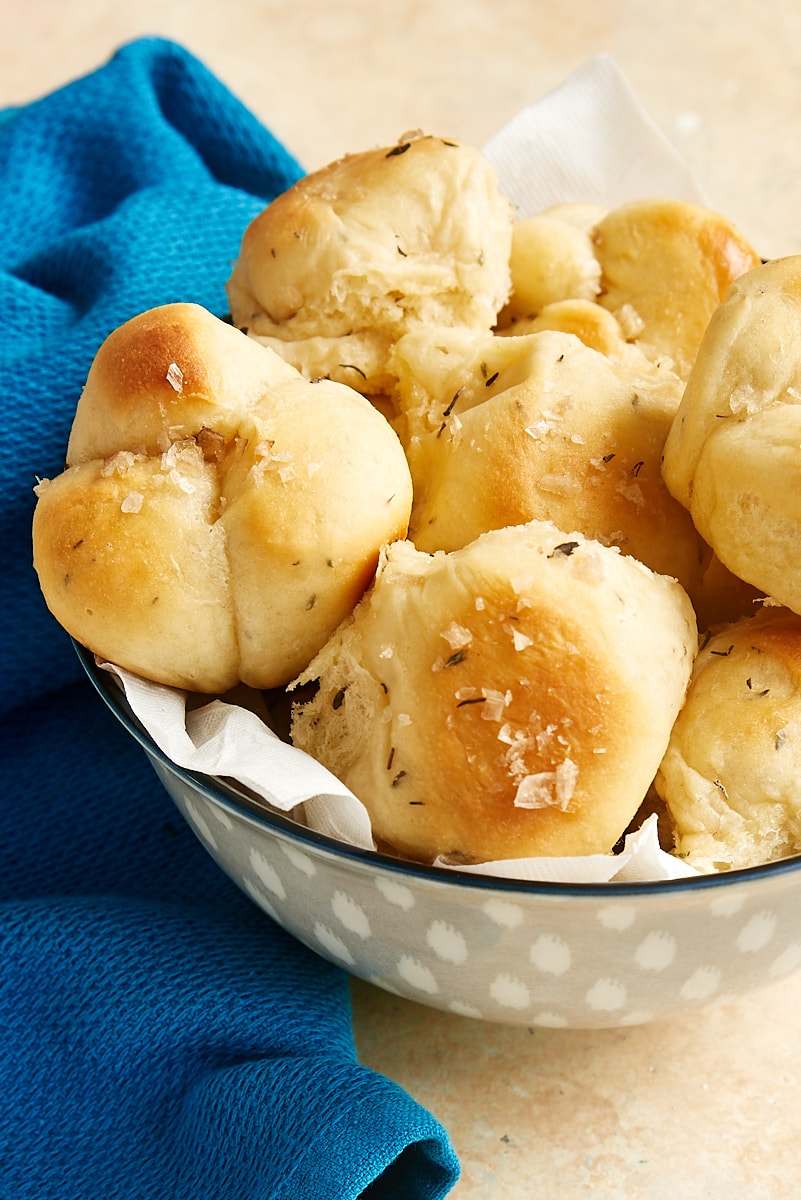 brown and serve rolls in a light gray serving bowl